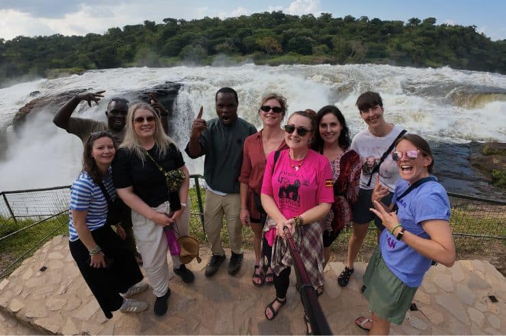Rock My Adventure group watching a giraffe in Lake Mburo National Park, Uganda